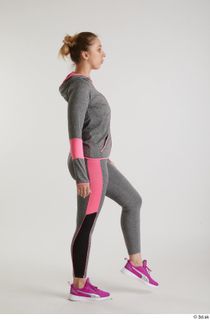  Mia Brown  1 dressed grey hoodie grey leggings pink sneakers side view sports walking whole body 0003.jpg